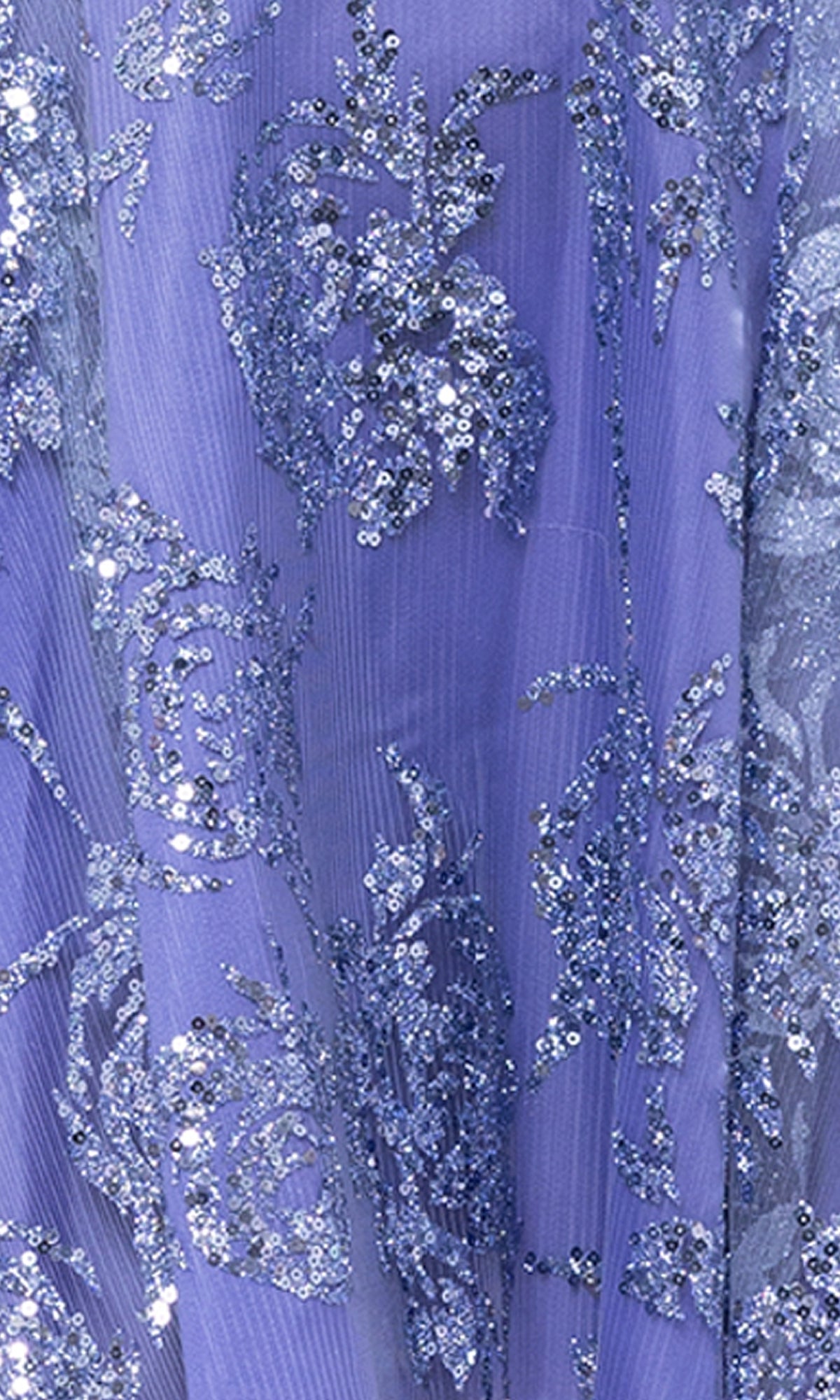 Close-up of the Short Periwinkle Hoco Dress: Blondie Nites 5017BN, showcasing lavender fabric with intricate floral patterns and sparkling sequins for a shimmering, textured look.